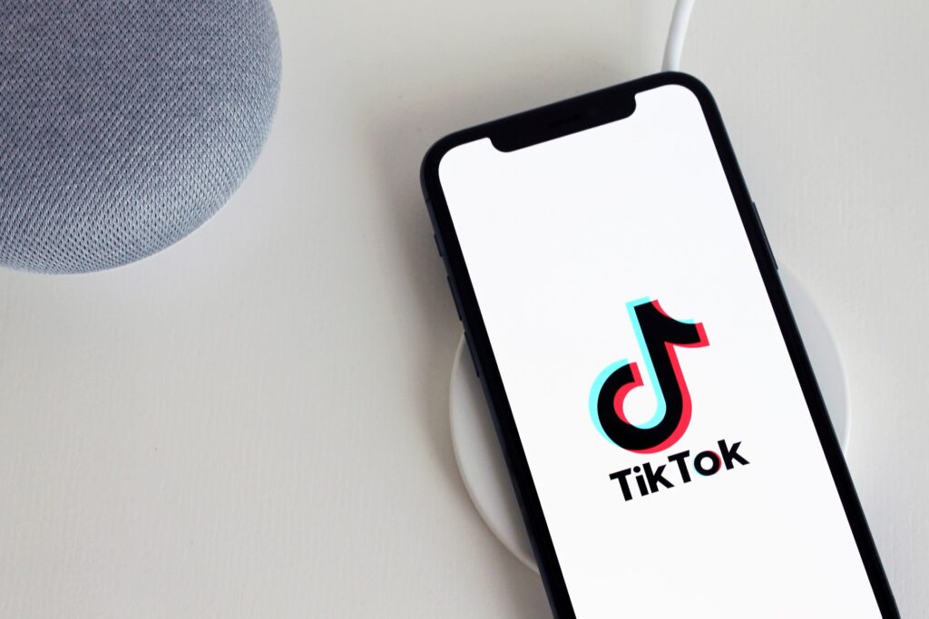 Phone showing the TikTok app, used to boost TikTok followers and reach